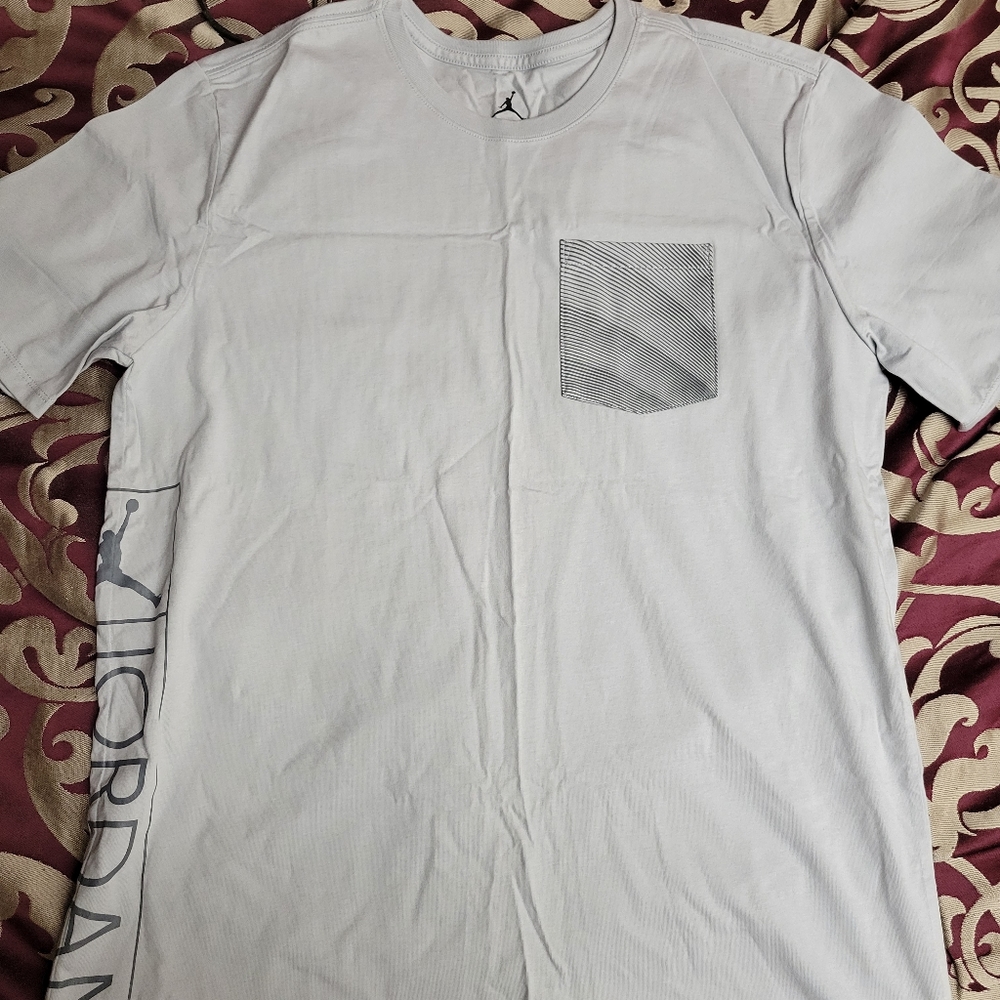 Brand new jordan tee size large in a light blue colorway.